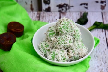 Indonesian Cuisine, Klepon or Traditional Pandanus Rice Balls Made From Glutinous Flour and Grated Coconut with Palm sugar Filling