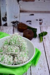 Indonesian Cuisine, Klepon or Traditional Pandanus Rice Balls Made From Glutinous Flour and Grated Coconut with Palm sugar Filling