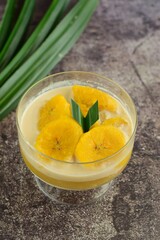 Indonesian Cuisine - Kolak Pisang or Plantain Banana Compote. Cooked with coconut milk, palm sugar and pandanus leaves. Ramadhan menu.