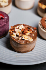 Several cakes are symmetrically laid out on a plate close up. Food delivery. Homemade baking.