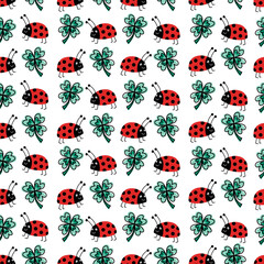 Good luck four-leaf clover and ladybug charms talisman seamless vector pattern. Repeating hand drawn fortune background. Use for New Years, fabric, packaging. Vector illustration.
