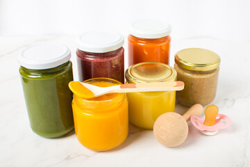 Variety of homemade baby vegetable and fruit puree