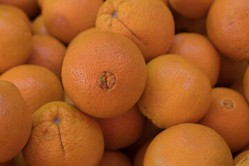 Fresh Oranges at the market counter.
