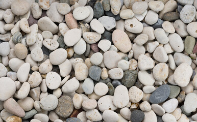 Overhead view of pebbles on the seashore. Background, backdrop or texture for banner