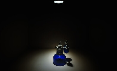 Vintage blue lamp in isolated and illuminated spotlight background. Vinatge items photography...