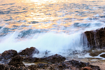 Blurred abstract natural background of sea water with waves and foam. Motion blur. Nature. 