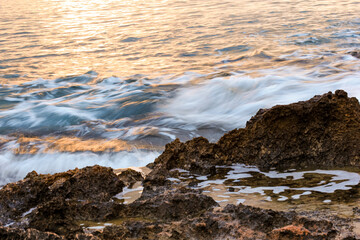 Blurred abstract natural background of sea water with waves and foam. Motion blur. Nature. 