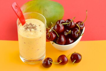 Refreshing drink mango cherry smoothie with flax seeds