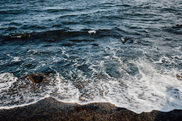 Wave on the rocky beach