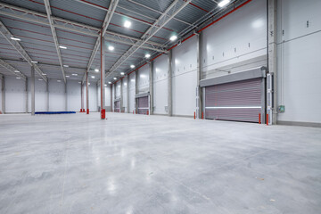 warehouse or hangar. Industrial building interior consist of polished concrete floor and closed...