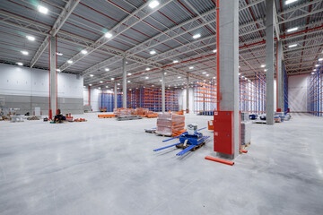 warehouse or hangar. Industrial building interior consist of polished concrete floor and closed door for product display or industry background.