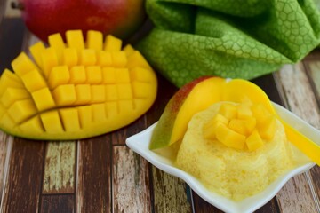 Mango pudding with cubed fresh mango on top