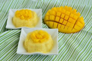 Mango pudding with cubed fresh mango on top