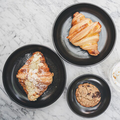 Close-Up Of Croissant Served In Black Plate , Fresh Baked Croissants. Warm Fresh Buttery Croissants and Rolls. French and American Croissants