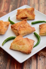 Homemade Martabak Telur, Indonesian cuisine. Pan-fried wrap filled with ground beef, egg and scallion. Served with green chilli Rawit