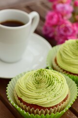 Matcha cupcakes with a cup of espresso
