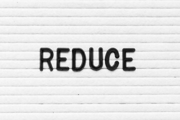 Black color letter in word reduce on white felt board background