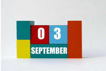 Day of month. Cube Calendar on multi-colored cubes on white background