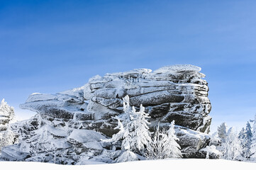 the rock is covered with snow in winter