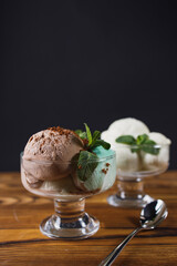 Ice-cream scoops variety in glass sundae bowls, refreshing dessert for summertime. Tasty homemade food, culinary concept