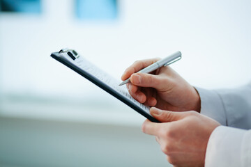 close-up. doctor filling out a medical form.