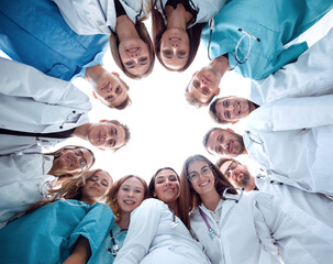 group of successful doctors standing in a circle