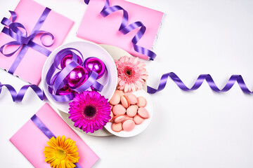 Spring flowers and sweets on white background