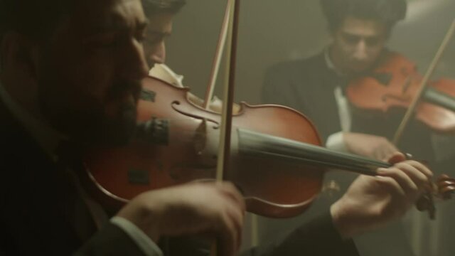 the string quartet plays classical music,medium shoot,