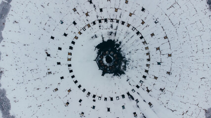 Top view aerial shot of famous Kyiv abandoned round bus park covered wtih snow, Ukraine