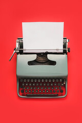 Vintage typewriter with white paper isolated