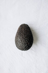 Brown avocado on white background.   