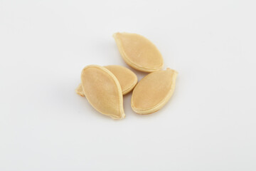 Pumpkin seeds on the white