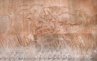 Historical art with relief of King Suryavarman II, the builder of Angkor Wat on army boat. Walls of Angkor What temple, 12th century Khmer landmark. Cambodian complex and UNESCO World Heritage Site
