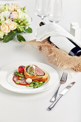 Easter meat roll, meatloaf for Easter dinner. Beautifully decorated catering banquet table with different food snacks and appetizers