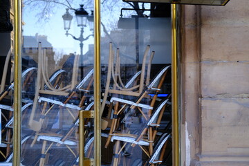 Some chairs piled up at a parisian cafe closed because of the coronavirus pandemic. Paris, February 2021.