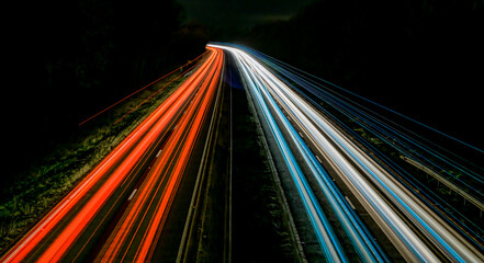 Motorway light streaks with curve off into the distance