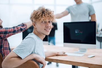 portrait of a young office employee in the workplace.