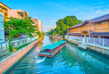 The passenger boat in narrow canal, Bangkok, Thailand