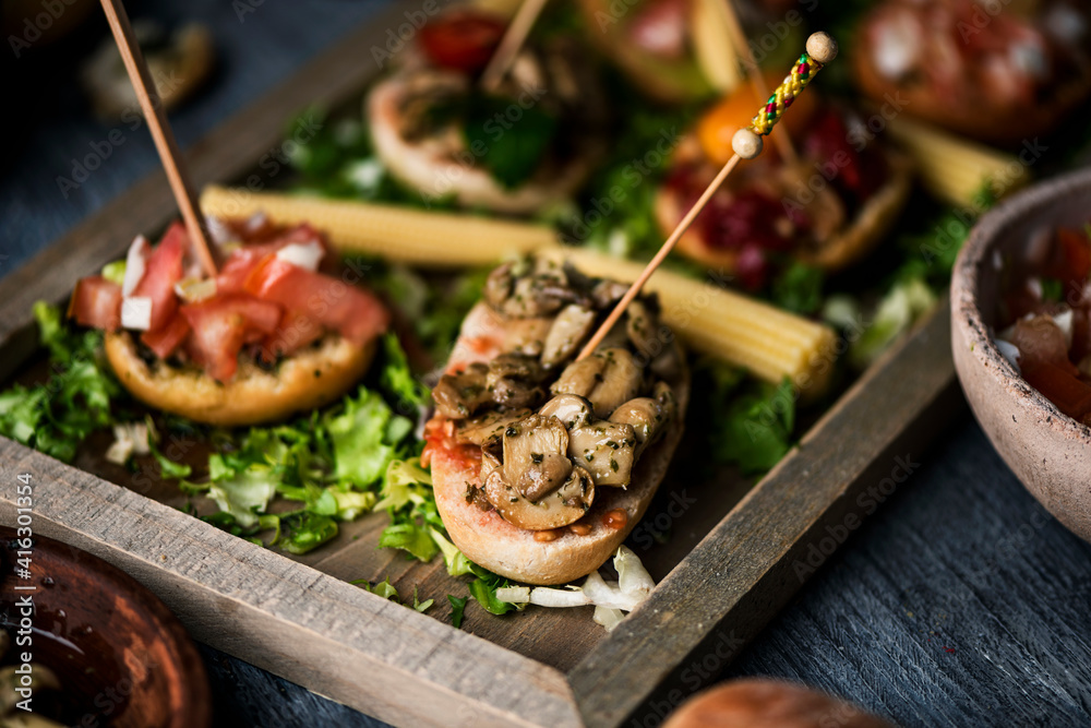 Sticker tray with an assortment of vegan spanish pinchos