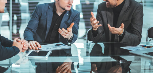 close up .young colleagues discussing financial data