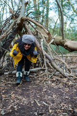 women in the forest with a yellow jacket 