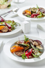 Grilled vegetables on a white plates. restaurant