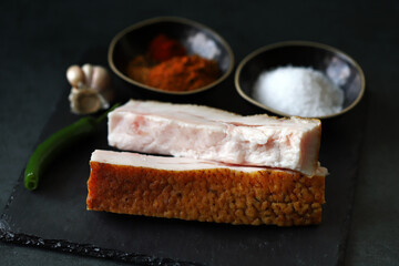 Fresh lard and spices. Salting lard.