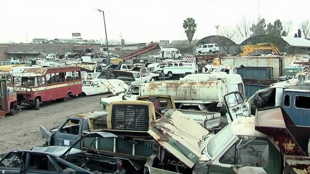 Old Wrecked Vehicles Stacked in a Junkyard in the Outskirts of Buenos Aires, Argentina. 