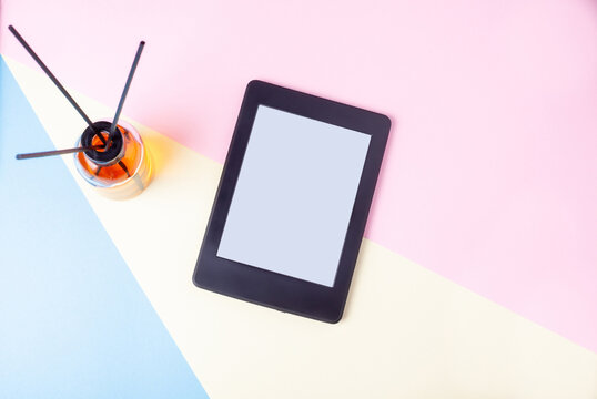 E book reader and aroma diffuser on geometric backgrond for calm reading and relaxing