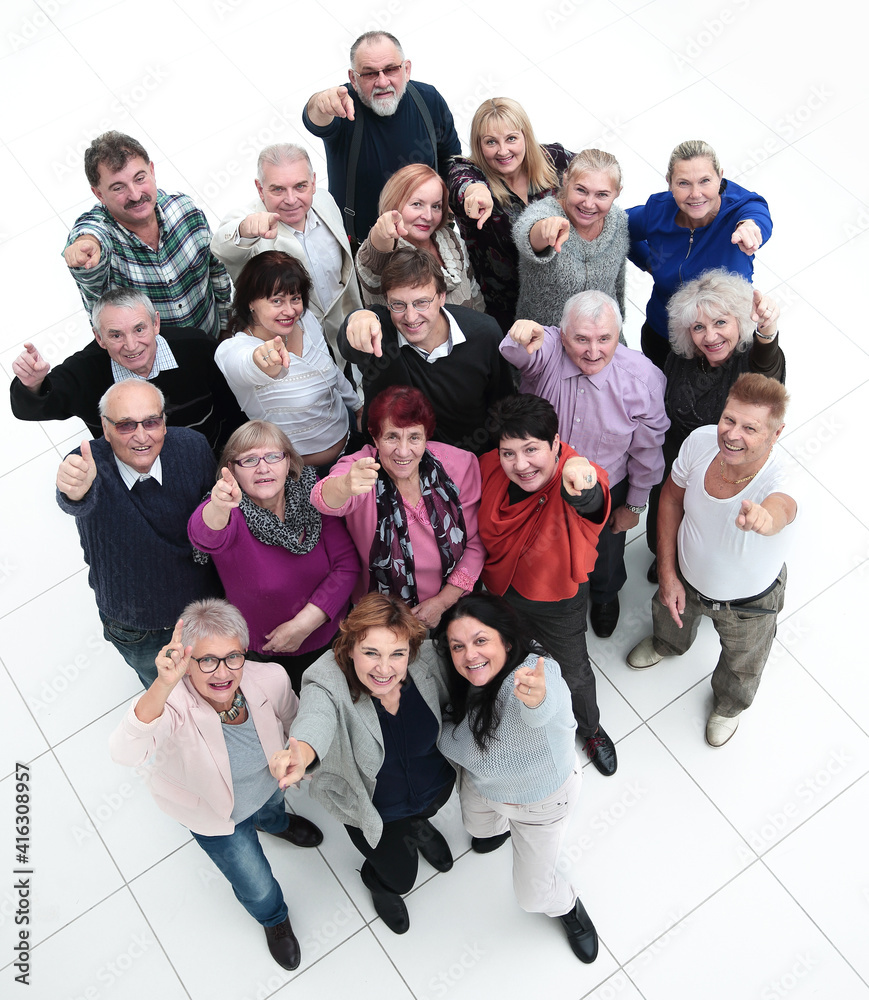 Wall mural group of happy elderly people pointing at you .