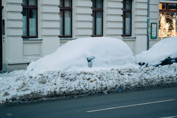 car completely covered in snow