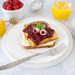 French toast with white chocolate mousse and raspberries.
