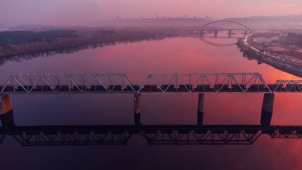 Railway bridge on the Dnieper River in Kyiv, Ukraine. Sunset