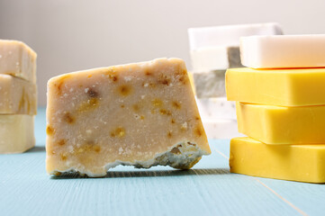 Natural bar soap with herbal ingredients. Yellow organic soap.